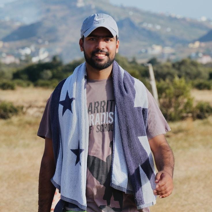 Ayla Chen, Lead Design Curator at CalmClusterPath, reviewing corporate floral arrangements